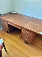 Full view of desk front showing drawers and top surface