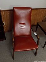 Full front view of high-back leather lounge chair