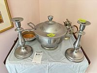 Full set showing bowl with ladle, candlesticks, creamer, wine coaster