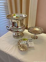 Three silver-plated pieces: urn, compote, shell dish