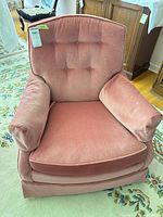 Front view of pink tufted club armchair
