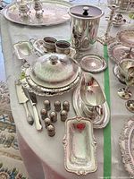 Full assortment of silverplate serving pieces and shakers