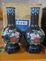 Both cloisonné vases on stands with presentation box