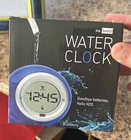 Front of retail box showing Bedol Water Clock image and branding