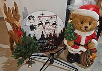 All items grouped: teddy bear Santa, wooden reindeer, quote sign, tabletop tree