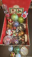 overview of entire ornament collection inside red storage box