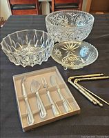 Group shot showing three bowls, utensil set in box, four metal picks