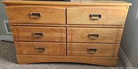Front view of the solid wood six-drawer dresser