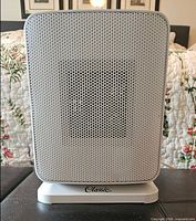 Front view showing grey grille and "Classic." stand