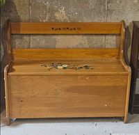 Front view of pine storage bench showing overall structure and finish