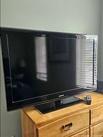 Front view of Samsung 52-inch TV on stand