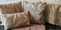 All four throw pillows grouped on sofa