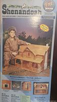 Front of boxed Shenandoah dollhouse kit showing finished model and branding