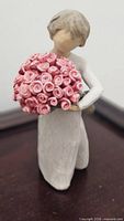 Front view of Willow Tree Abundance figurine showing bouquet of pink roses