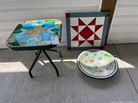 Group shot of bowl, table and barn quilt decor