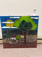 Full front view of stained glass panel against wall