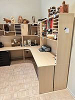 Full view showing complete wrap-around birch desk system with shelving and cubbies