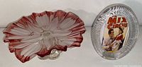 Pedestal dish and oval frame side by side