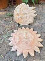 Both terracotta plaques standing and lying to show overall design