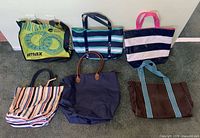 All six tote bags laid out for overview