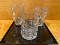 Overall view of ice bucket, pitcher, vase on tray