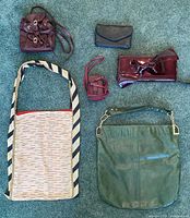 All six bags arranged on floor