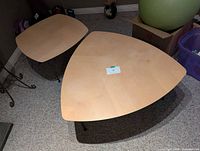 Square and triangular tables side by side, showing tops