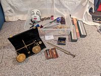 Group shot showing scale, mask, container with assorted items
