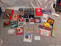 Group shot of all coin sets, loose coins, stamps