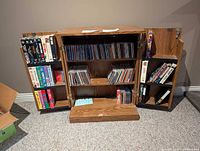 Overall view of media cabinet showing quantity of CDs and VHS tapes included