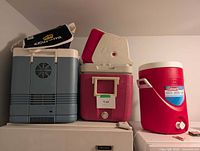 Group of five coolers on appliance top