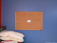 Front view of cork board on wall