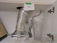 All three crystal vases together in cabinet