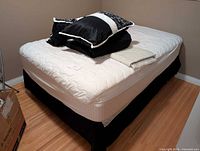 Overall view of assembled bed with linens