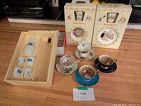 Lot overview showing Bunnykins boxes, sake set box, three teacup and saucer sets