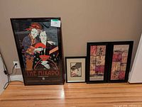Group shot of all four framed artworks leaning against wall