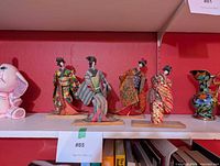 All four Japanese paper dolls on shelf