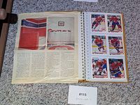 Binder open showing newspaper clipping on left and first sheet of six Montreal Canadiens cards on right