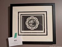 Full view of framed print on wall