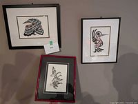 All three framed Indigenous bird prints on wall