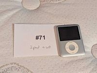 iPod Nano beside lot card