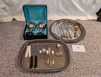 Overall lot showing goblets in case, both platters, assorted cutlery
