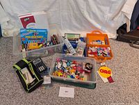 overview of all bins with stationery items including calculator and notebooks