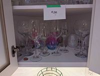Shelf showing all stemmed wine glasses, tumblers and shot glasses