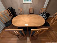 Dining table with eight chairs viewed from end