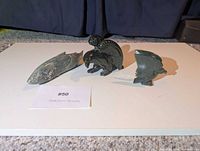 All three stone animal carvings displayed together