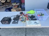 Overall view of power supply, two transmitters, motors, body shell, Tekin box and tote