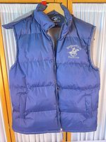 Front view of navy Beverly Hills Polo Club puffer vest showing overall design, pockets and zipper
