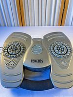 Top view of HoMedics gray foot massager showing textured footpads, handle, overall condition