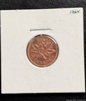 Reverse showing maple leaf twig design and date 1964